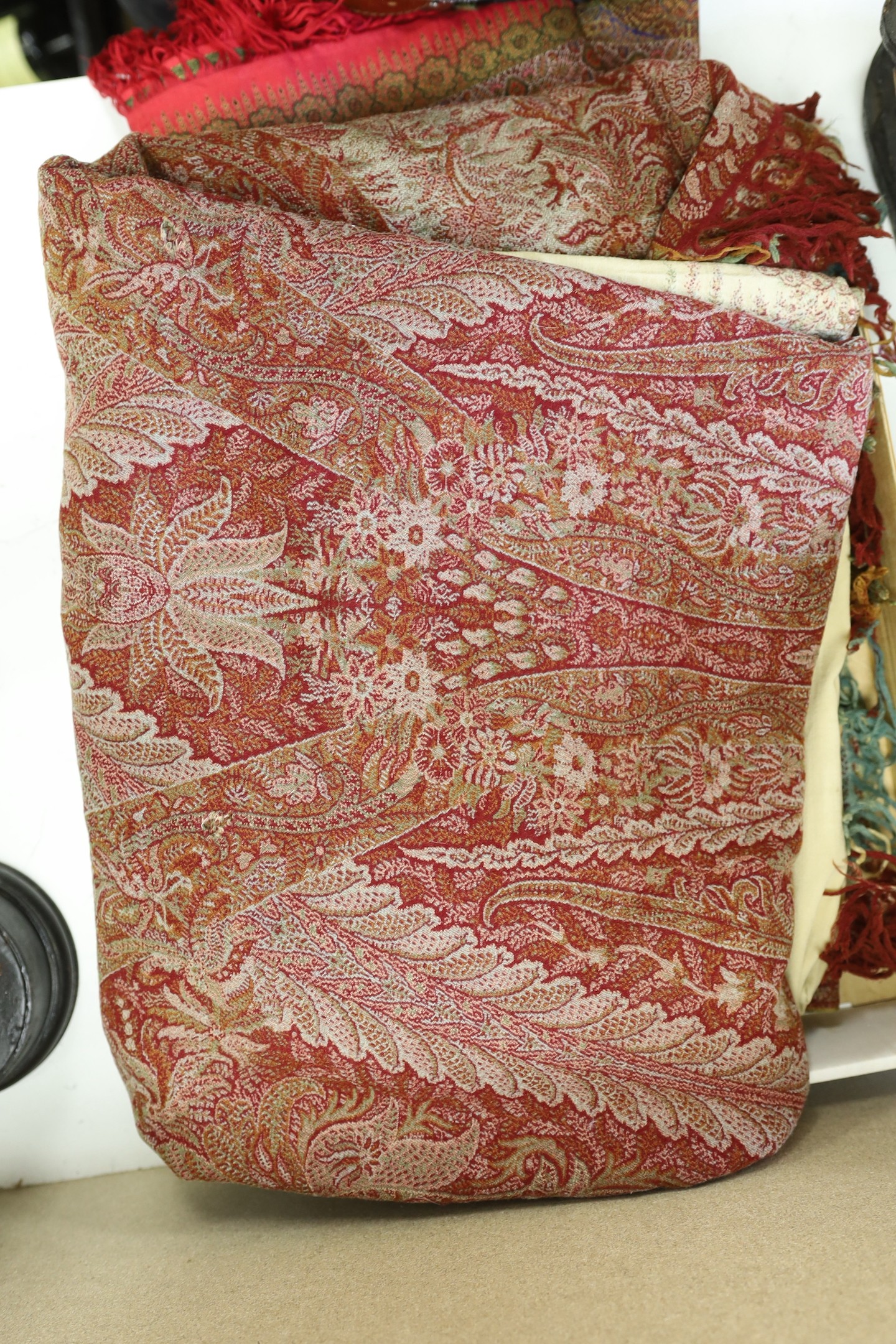 Large19th century paisley shawl and similar silk paisley shawl, cut into panels.